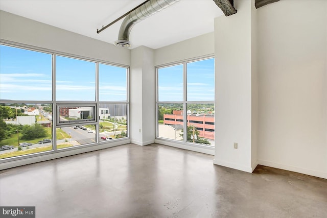 spare room featuring concrete floors