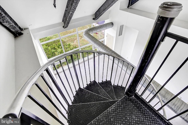 stairway with a towering ceiling