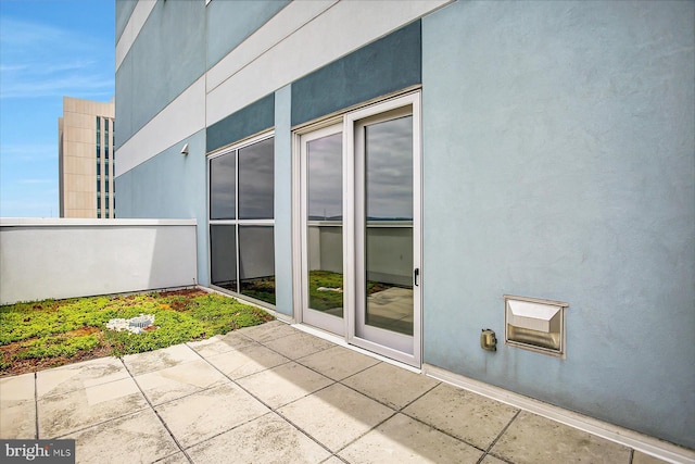 view of side of property featuring a patio