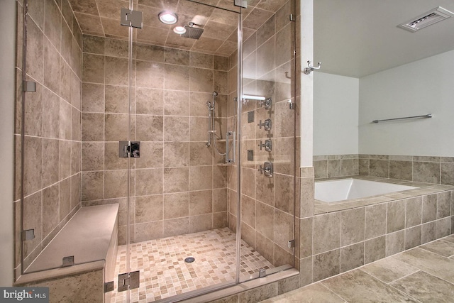 bathroom with plus walk in shower and tile patterned flooring