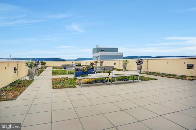 view of patio / terrace with a mountain view