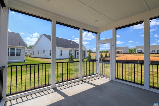 unfurnished sunroom with plenty of natural light