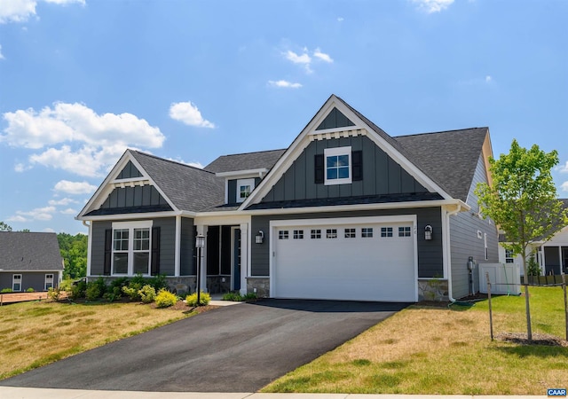 view of front facade with a front yard and a garage