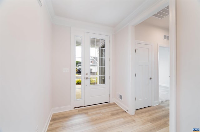 entryway featuring light hardwood / wood-style flooring and ornamental molding