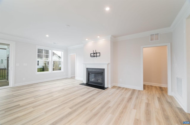 unfurnished living room with light hardwood / wood-style floors and crown molding