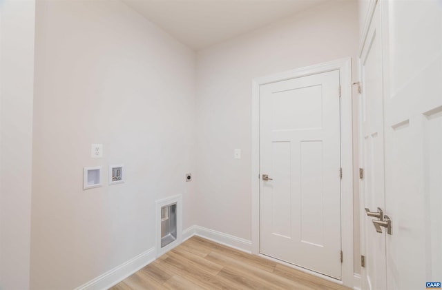 laundry area with hookup for an electric dryer, light wood-type flooring, and washer hookup