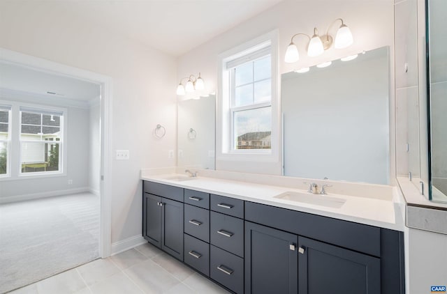 bathroom featuring vanity, tile patterned floors, and a healthy amount of sunlight