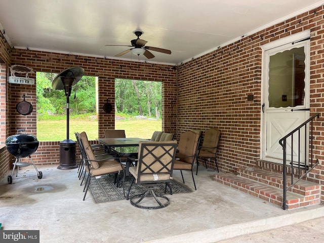 view of patio featuring ceiling fan and grilling area