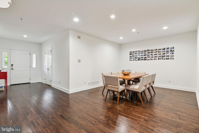 dining space featuring dark hardwood / wood-style flooring