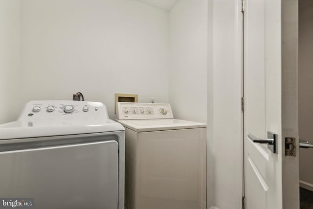 laundry area with washing machine and clothes dryer