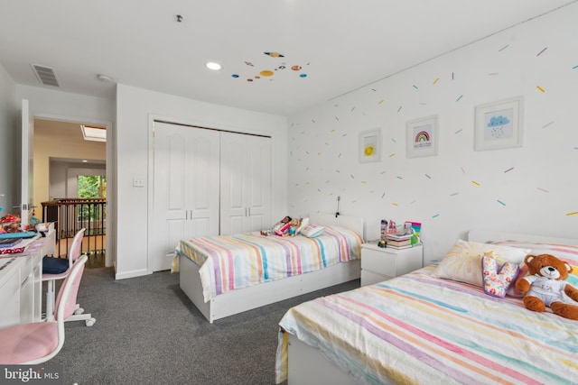 carpeted bedroom featuring a closet