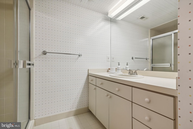 bathroom with vanity and walk in shower