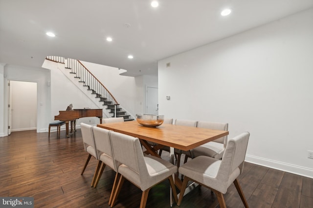 dining space featuring dark wood-type flooring