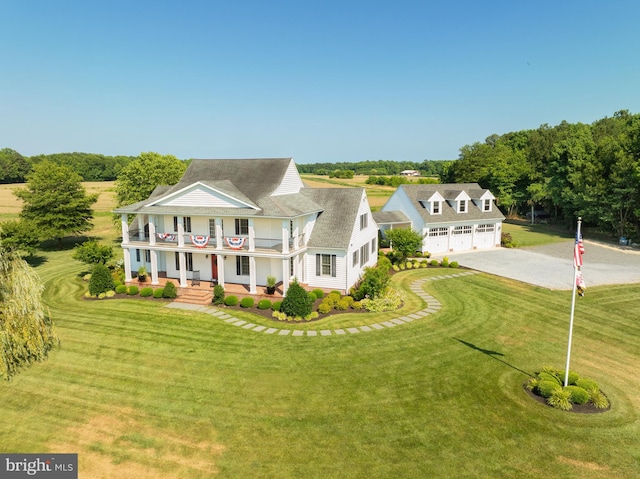 view of front of property with covered porch and a front yard