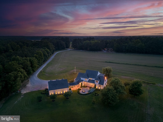 aerial view at dusk featuring a rural view