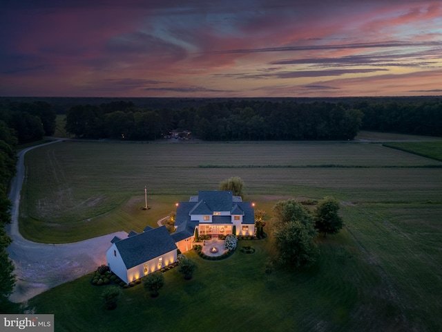 aerial view at dusk featuring a rural view