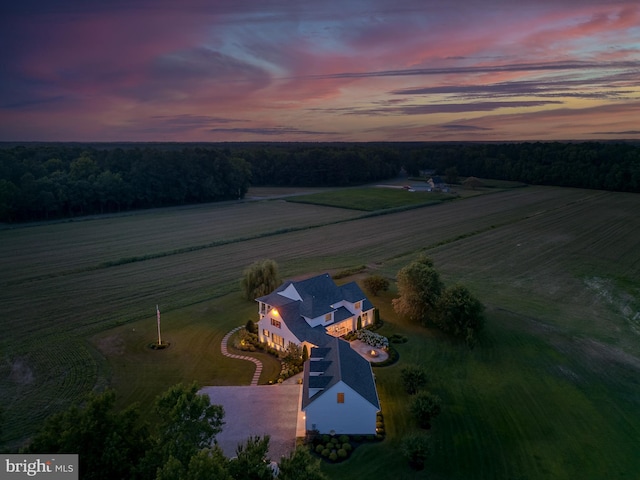 aerial view at dusk featuring a rural view