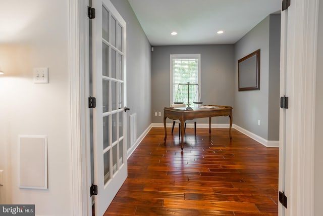 office with wood-type flooring and french doors