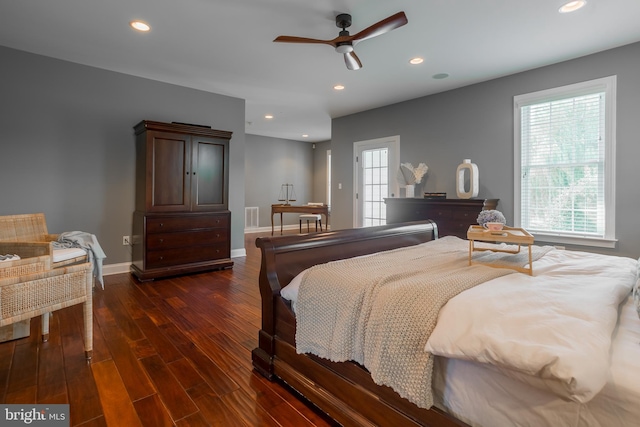 bedroom with ceiling fan and dark hardwood / wood-style flooring