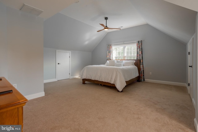 bedroom with light colored carpet, lofted ceiling, and ceiling fan