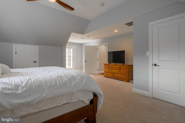 carpeted bedroom with ceiling fan and lofted ceiling