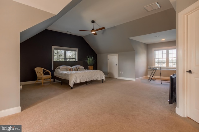 bedroom featuring ceiling fan, lofted ceiling, and light colored carpet