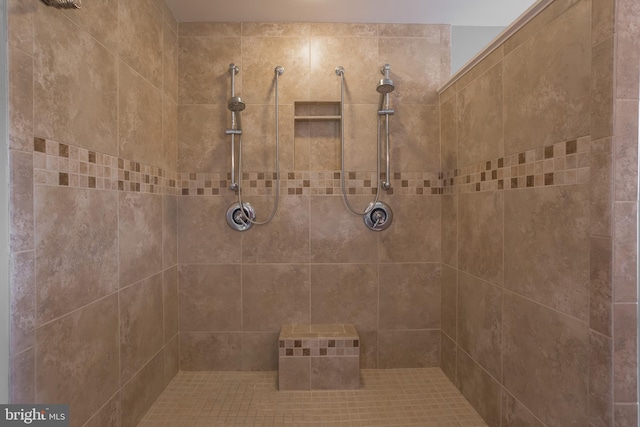 bathroom featuring a tile shower