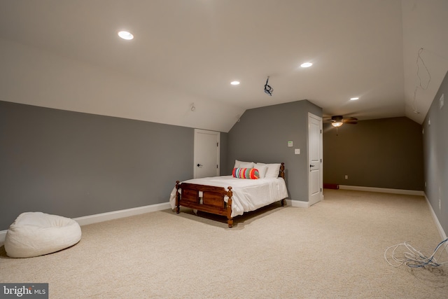 bedroom with carpet flooring and lofted ceiling