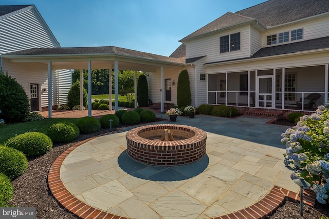 view of patio featuring an outdoor fire pit