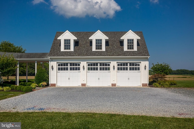 cape cod house featuring a garage