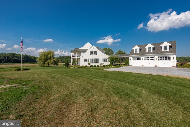 view of front facade with a garage and a front yard