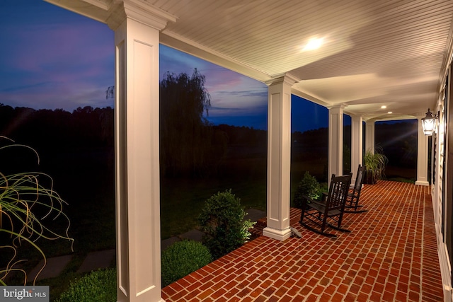 view of patio terrace at dusk