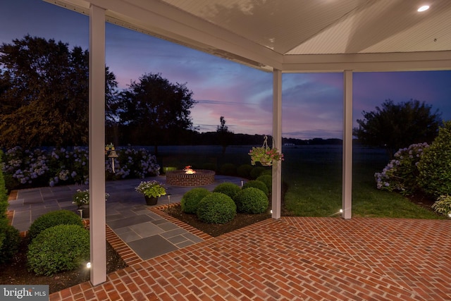 patio terrace at dusk with an outdoor fire pit