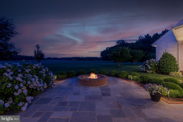 patio terrace at dusk with an outdoor fire pit