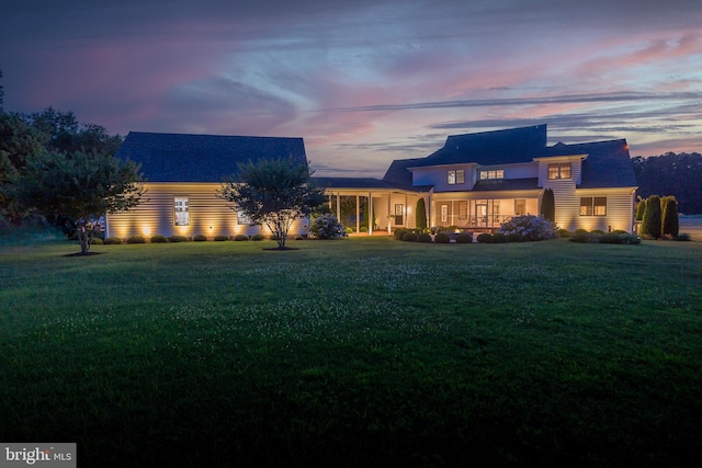 view of front of property with a yard