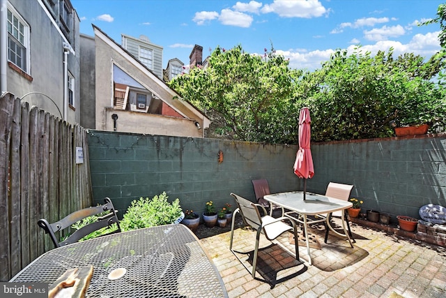 view of patio / terrace featuring outdoor dining area and a fenced backyard