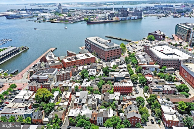 birds eye view of property featuring a view of city and a water view