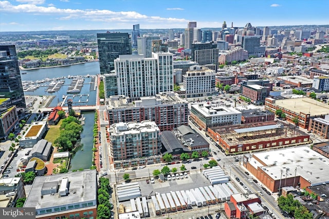 drone / aerial view featuring a water view and a city view