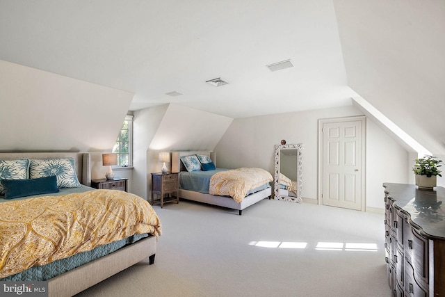 bedroom featuring light carpet and lofted ceiling