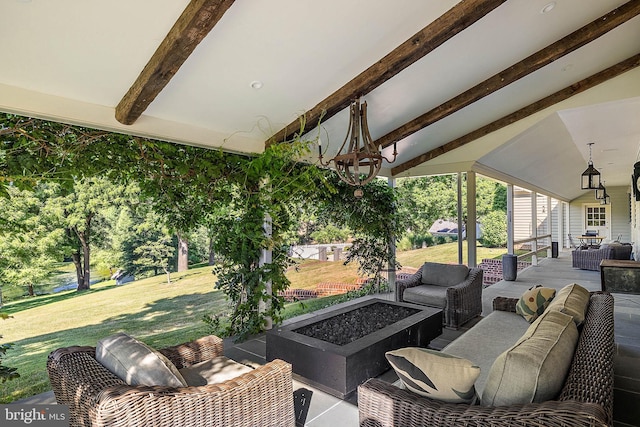 view of patio featuring an outdoor living space with a fire pit