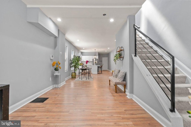 entryway with light hardwood / wood-style floors