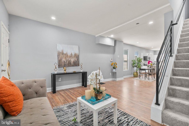 living room with light hardwood / wood-style flooring