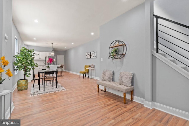 interior space with a chandelier and light wood-type flooring