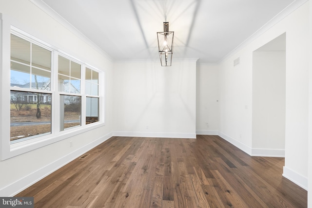 unfurnished dining area featuring dark hardwood / wood-style flooring and crown molding