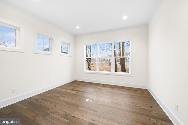 spare room with dark wood-type flooring