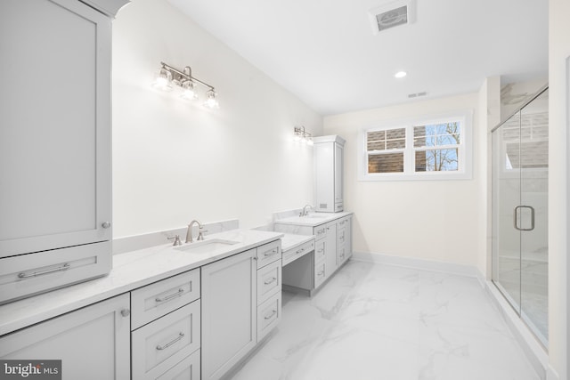 bathroom featuring vanity and a shower with shower door