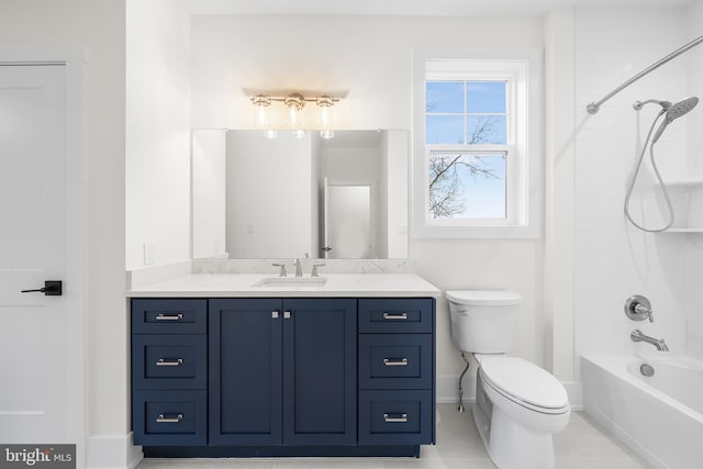 full bathroom featuring tile patterned floors, vanity, tiled shower / bath combo, and toilet