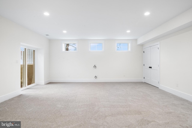 carpeted spare room with a wealth of natural light