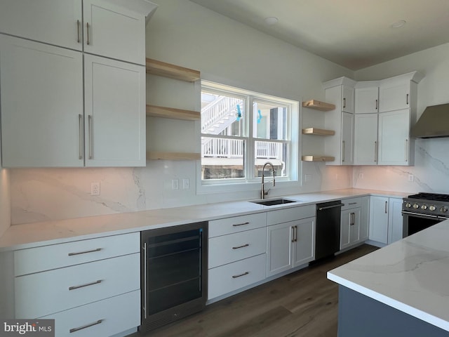 kitchen with beverage cooler, open shelves, a sink, and white cabinets