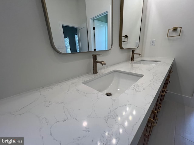 bathroom featuring double vanity and a sink